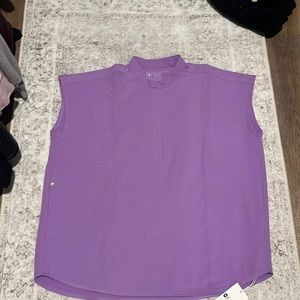 Scrub top new with tags no plastic wrap included. I only ever tried it on.